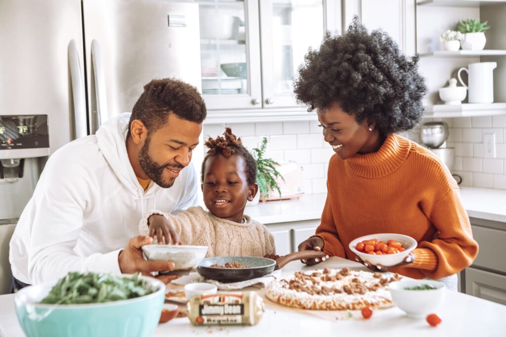 family making dinner with toddler