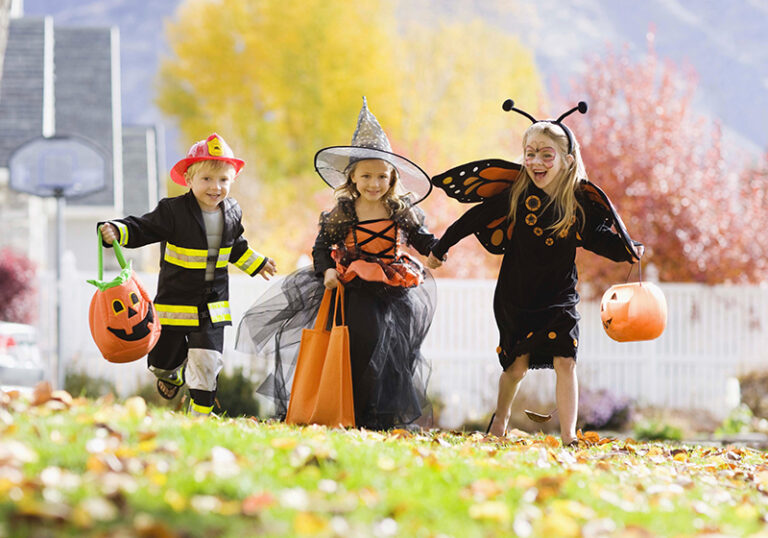 Kids Trick or Treating with costumes on